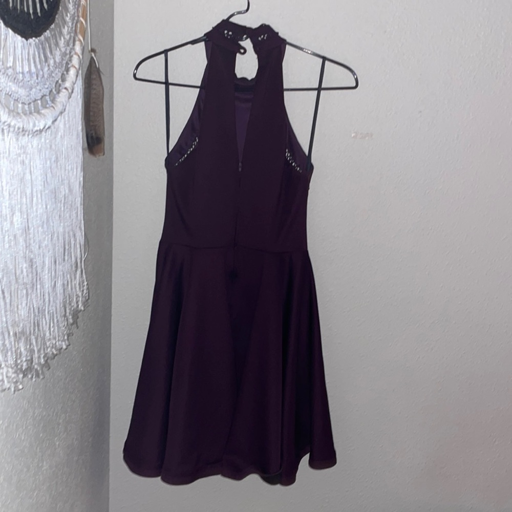 Purple mini dress. Sleeveless with open back and two buttons on the back.